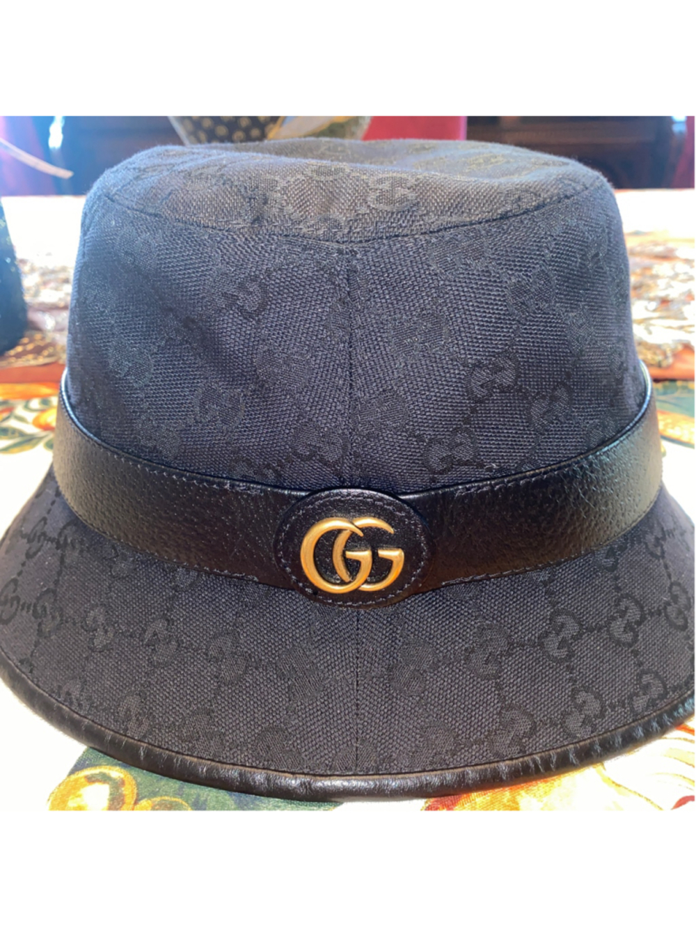 Women's Gucci GG Logo Bucket Hat in Black and Gold, size M